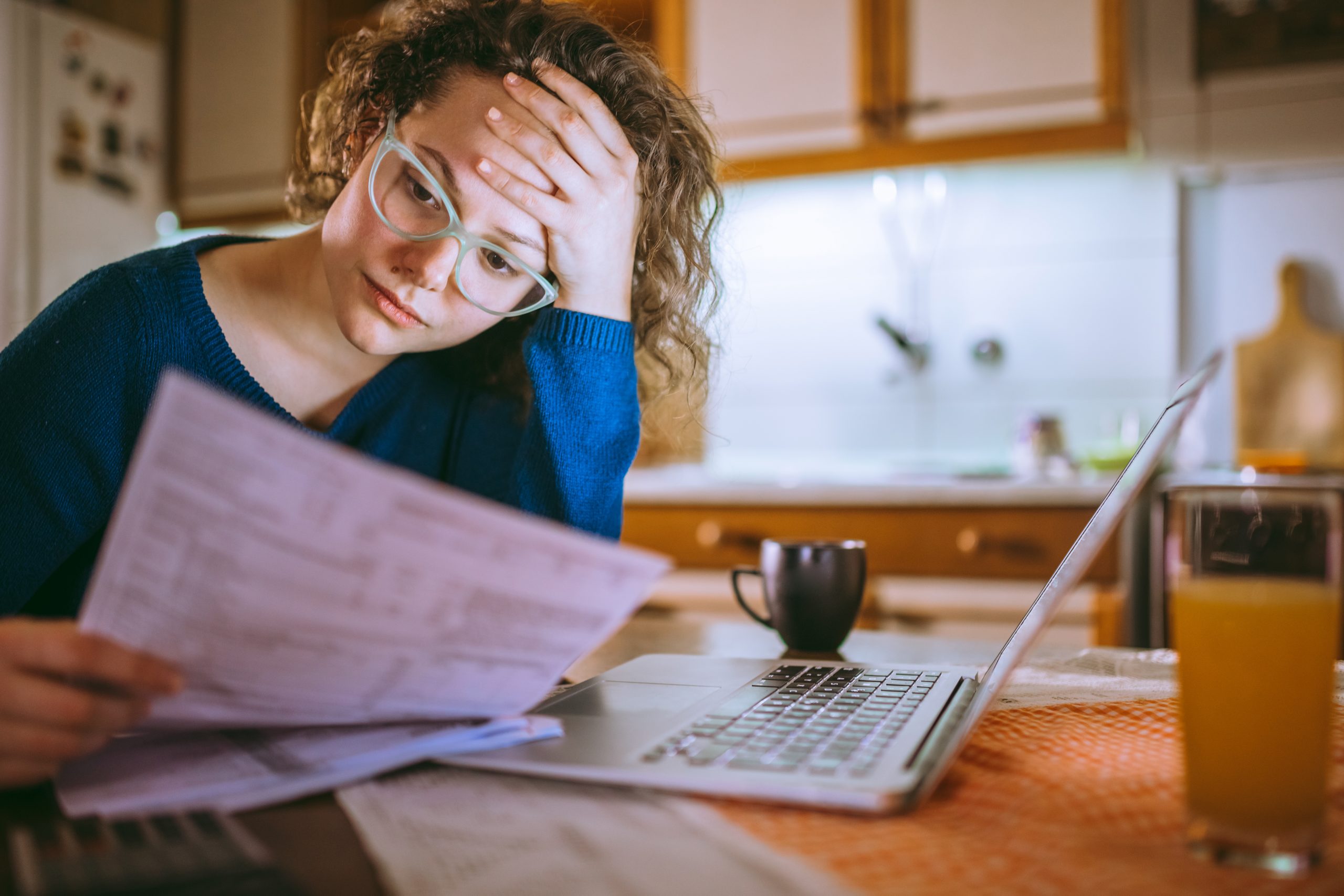 a woman frustrated with invoices